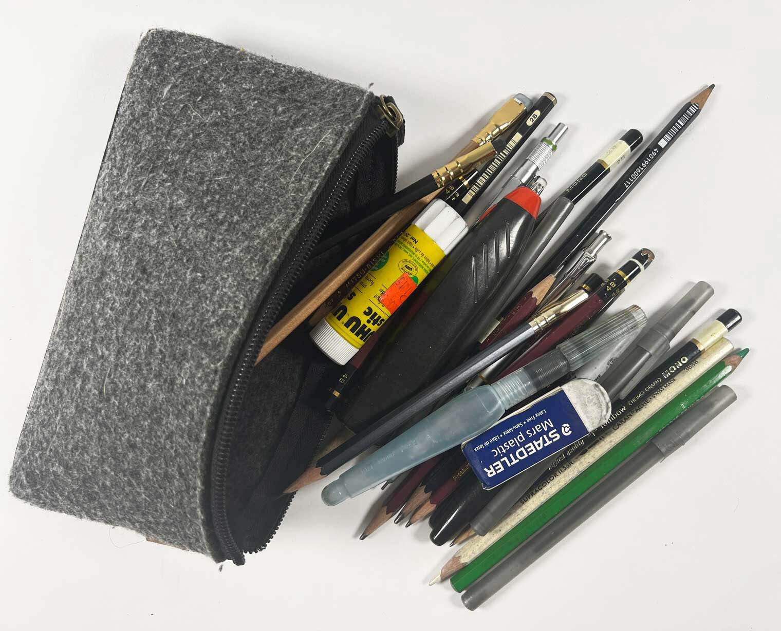 Art supplies spilling out of pencil pouch